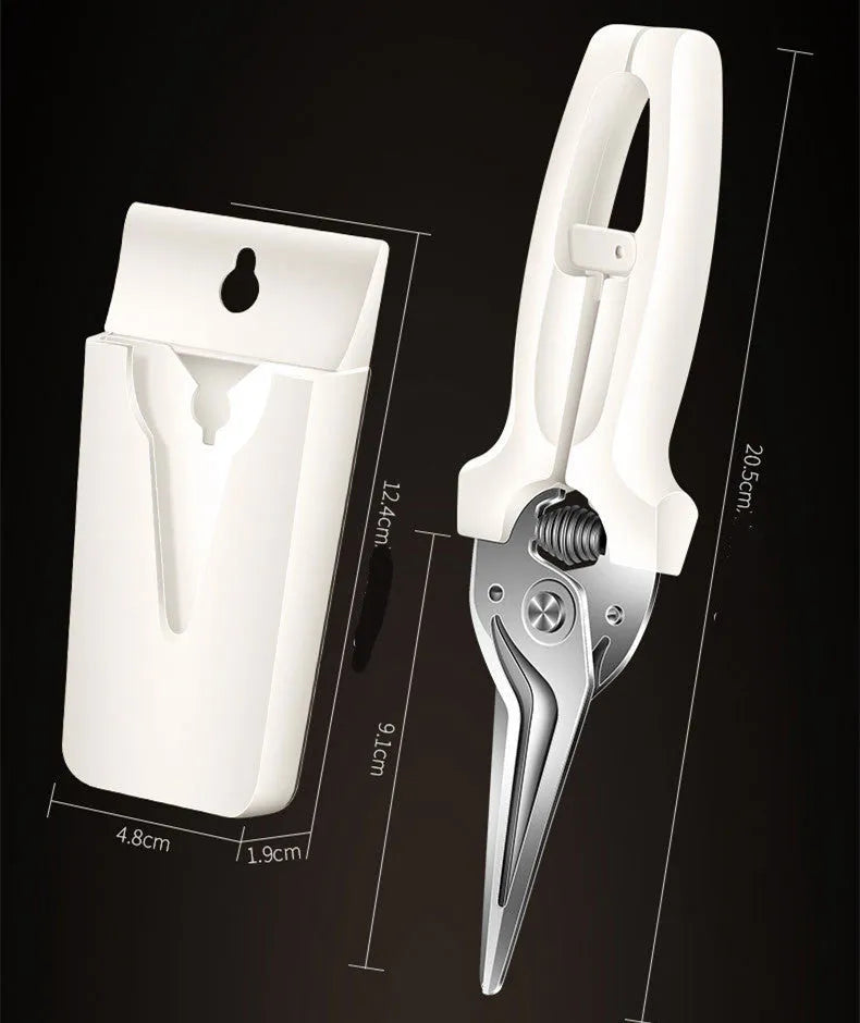 Creative magnetic suction kitchen scissors in stainless steel on a fridge door