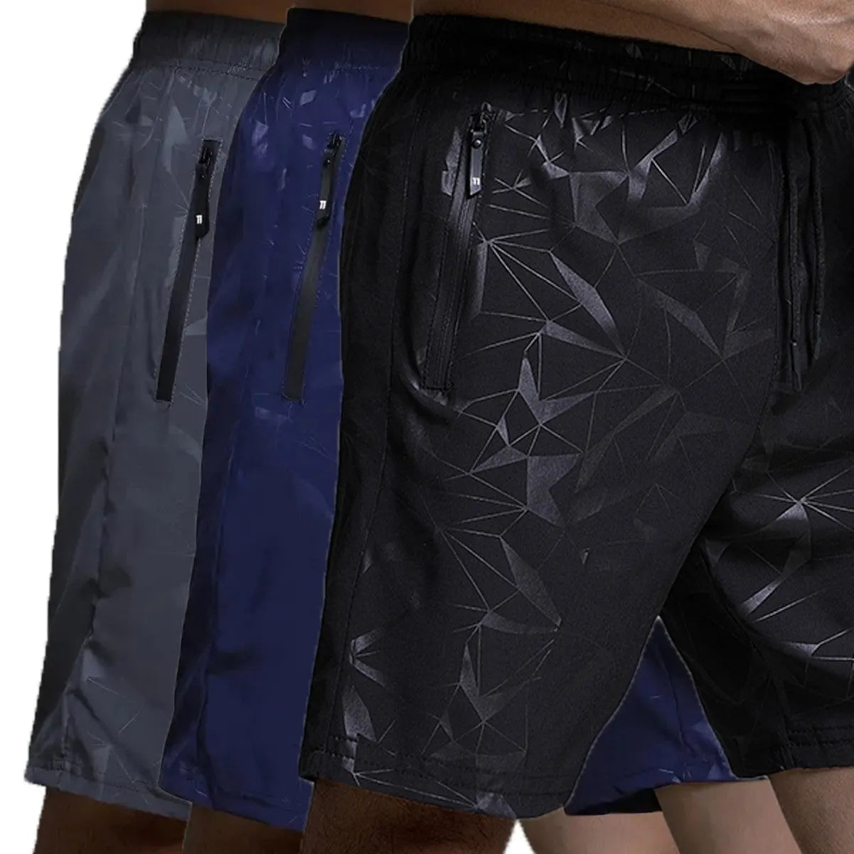 Man wearing loose fit black polyester sports shorts with elastic waistband