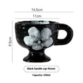 Hand-pinched irregular ceramic mug showing solid colour and unique shape