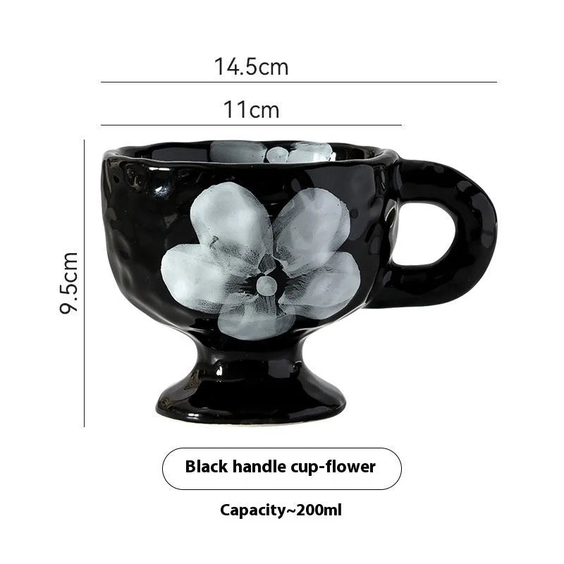 Hand-pinched irregular ceramic mug showing solid colour and unique shape
