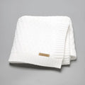 Solid colour infant blanket with raised line texture in beige khaki, laid flat showing 70x90cm size.
