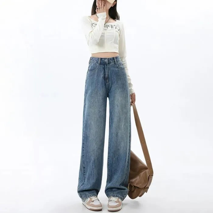 Women's retro blue high-waist wide leg jeans laid flat, showing the straight-leg trousers cut.