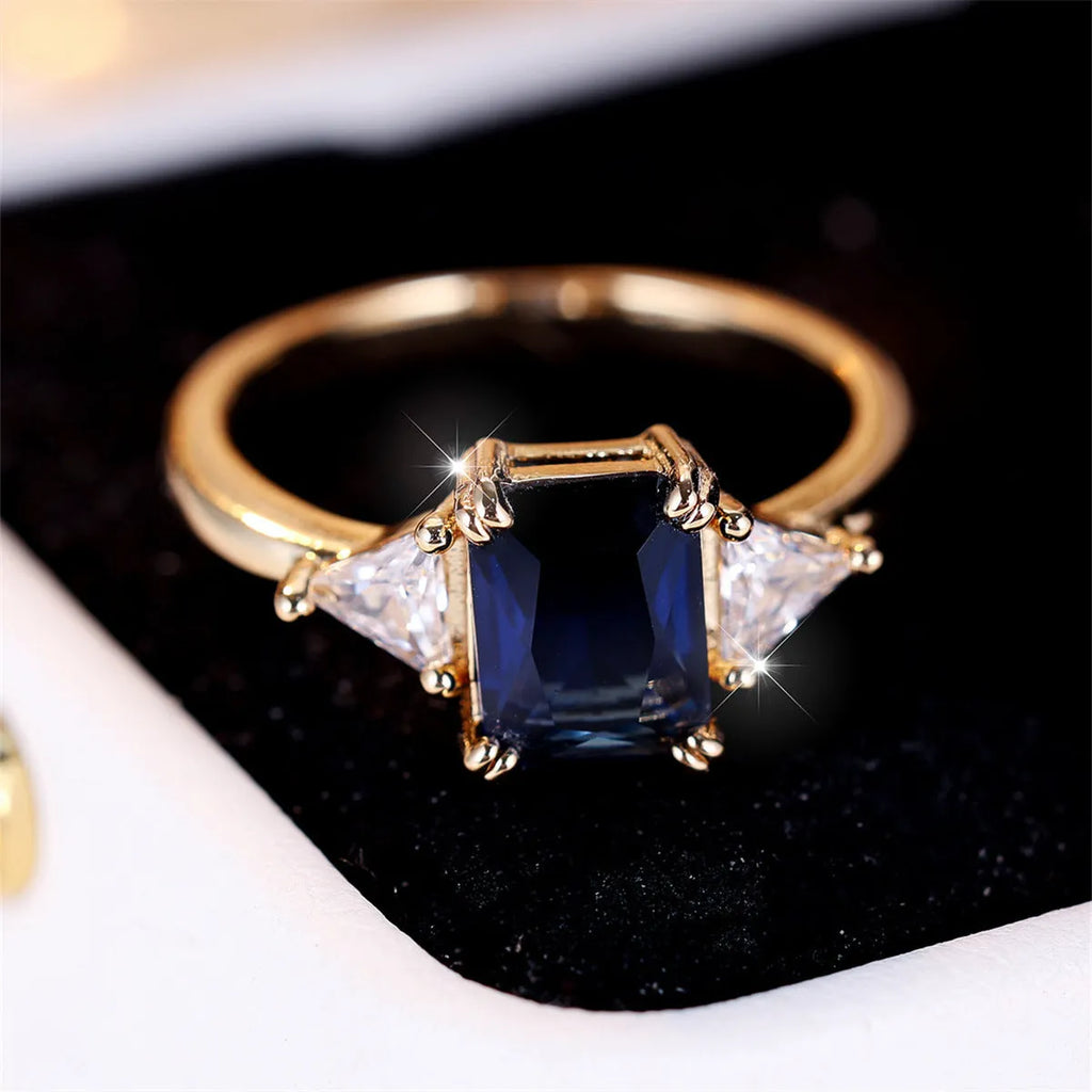 Rectangular gold sapphire blue copper women's ring showing geometric band shape