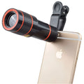 12X phone camera telescope with black clip on white background