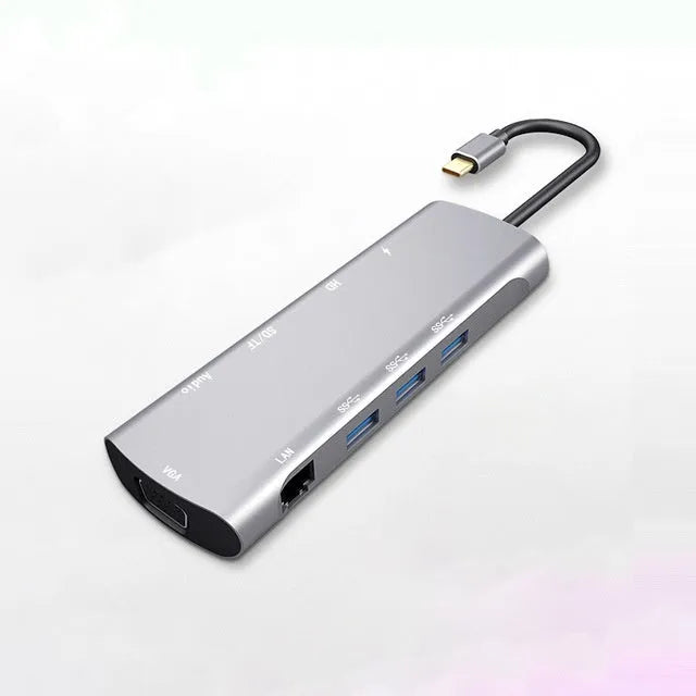 Grey aluminium USB C docking station with HDMI, VGA, and USB ports.