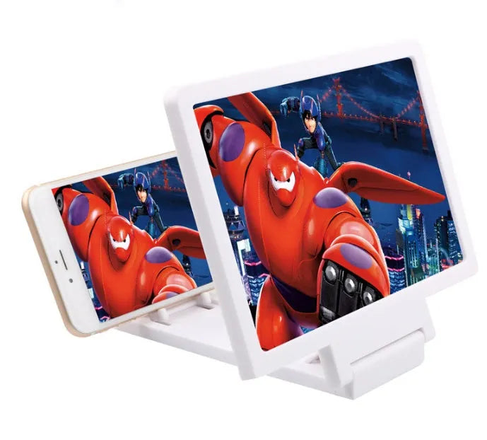 Black and white adjustable mobile phone stand with anti-radiation 3D screen amplifier on a desk.