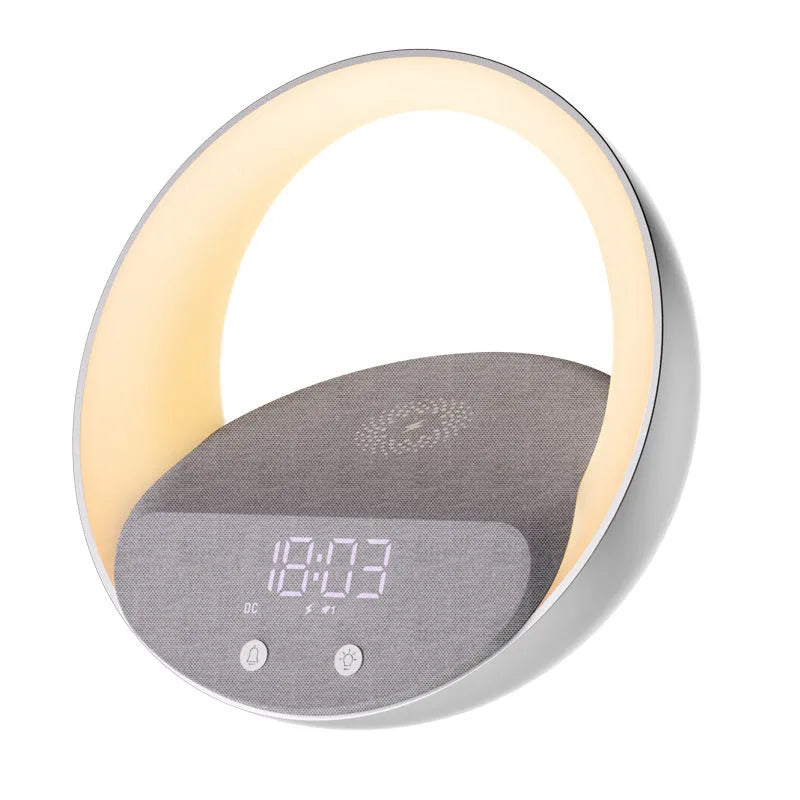 Beige multifunctional wireless charging clock with Bluetooth speaker and warm white LED wake-up light on a wooden table.