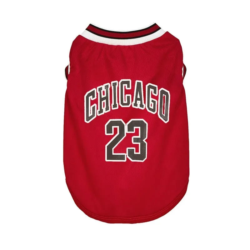 Dog wearing a black mesh polyester basketball vest with number 23 print, side view