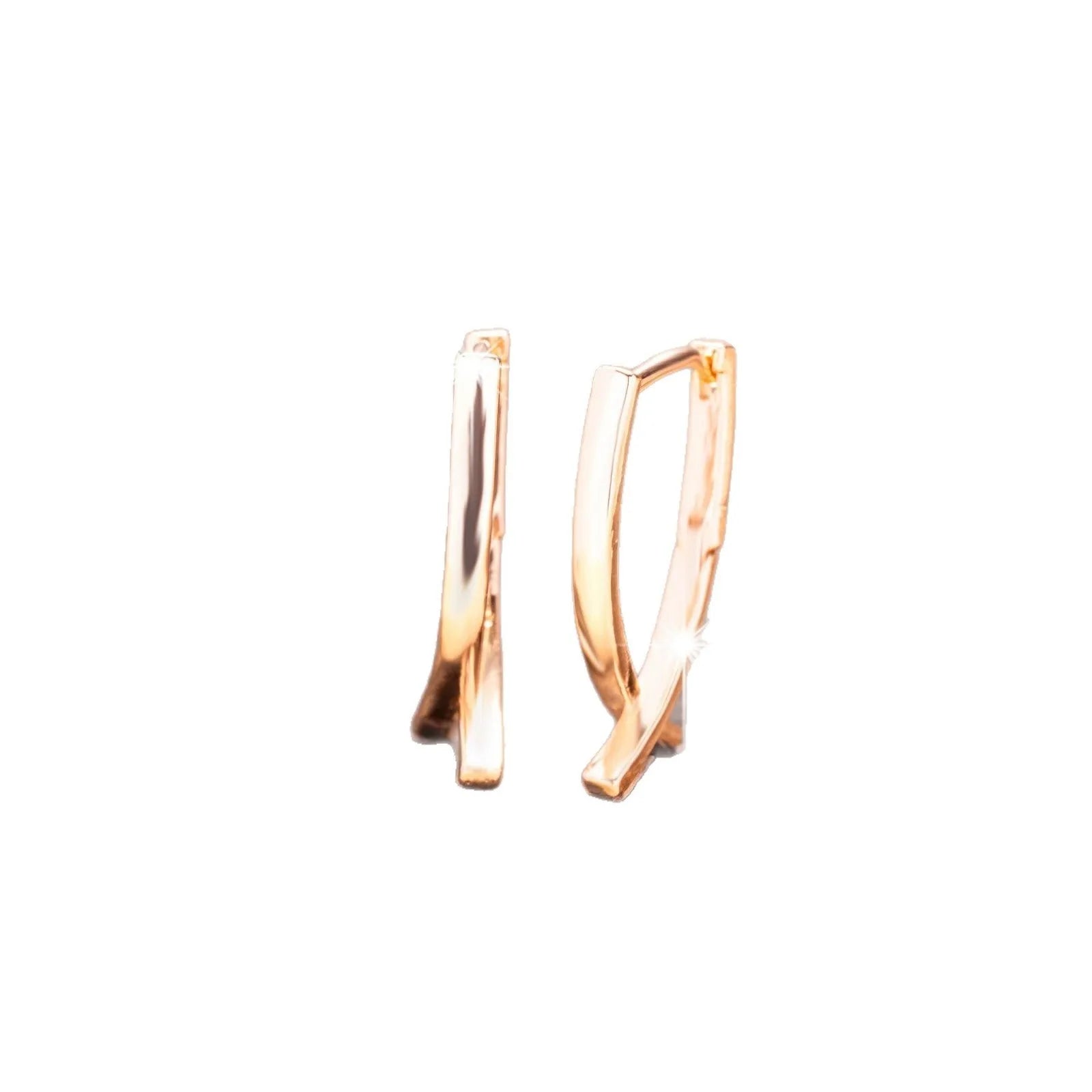Rose gold copper cross shaped earrings with light luxury aesthetic