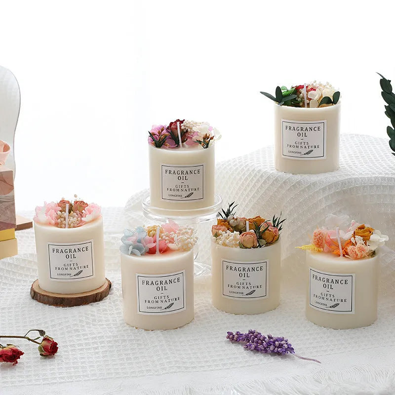Aromatherapy candle with dried flowers on surface, shown in gift box with chip base.