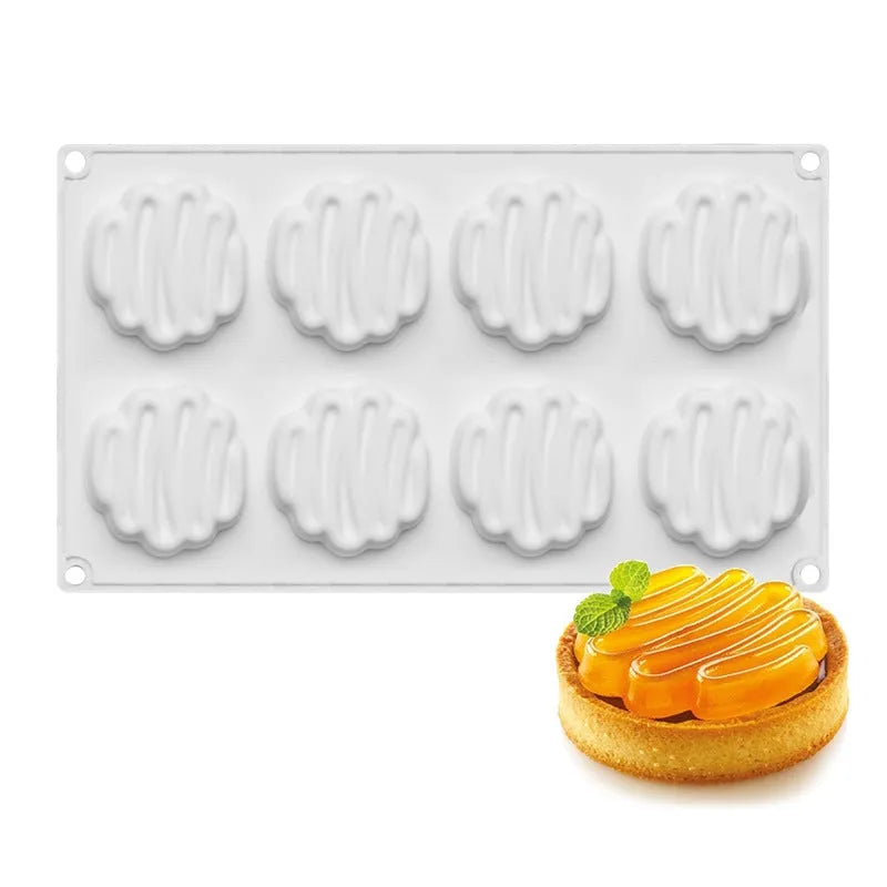 Round silicone cake mould with 8 raised bubble towers for tiered desserts.