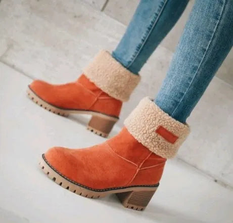 Women's mid-calf suede snow boots in black with a thick low heel and waterproof platform.