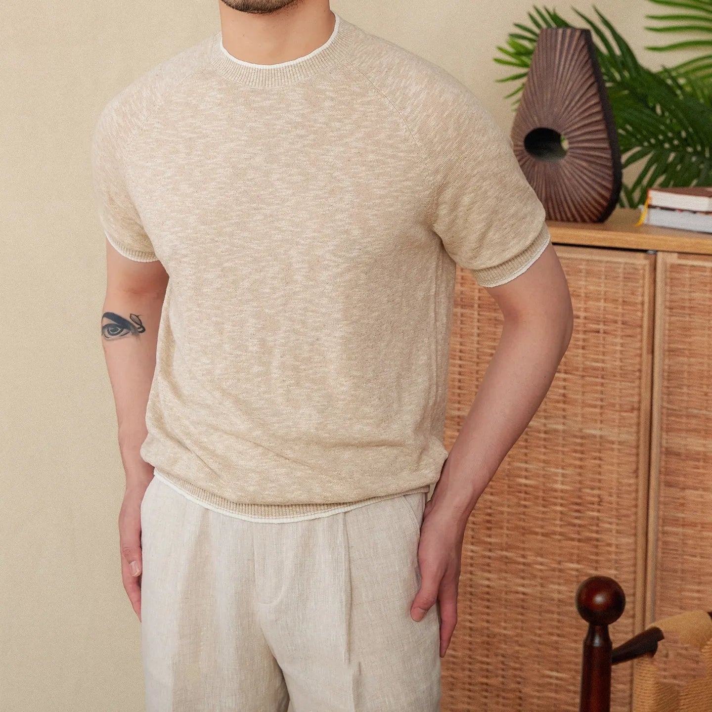 Brown linen cotton casual t-shirt with round neck and short sleeves on hanger