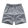 Men's drawstring summer leisure shorts in straight leg design with elastic polyester fabric