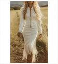 Lady's long-sleeved long-length white tassel dress with flowing silhouette and tassel trim at hem