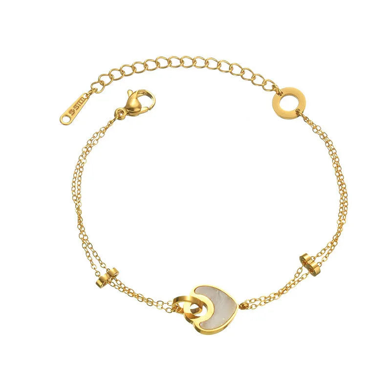 Stainless steel bracelet for women with a double-layered red resin heart charm on a metallic chain.