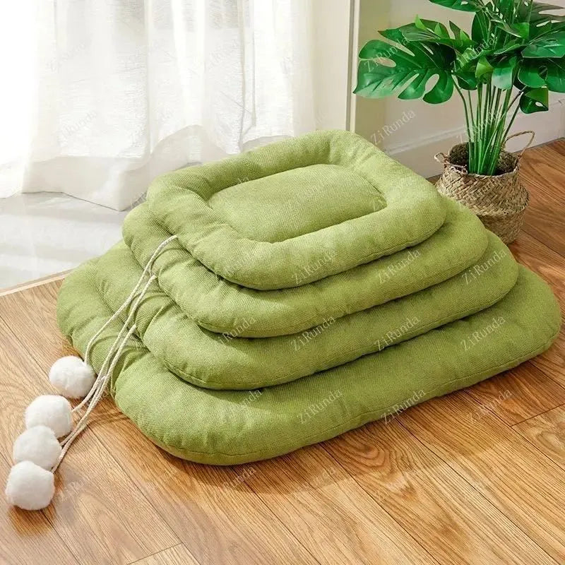 Brown and green pet cushion with removable cover shown in four sizes for small to medium dogs and cats