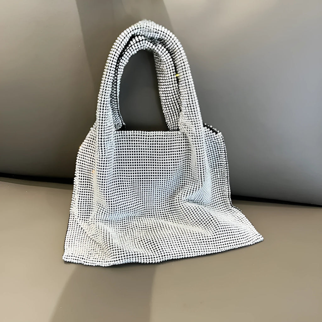 Silver ladies handbag with rhinestone embellishment on cotton thread construction and open outer pocket