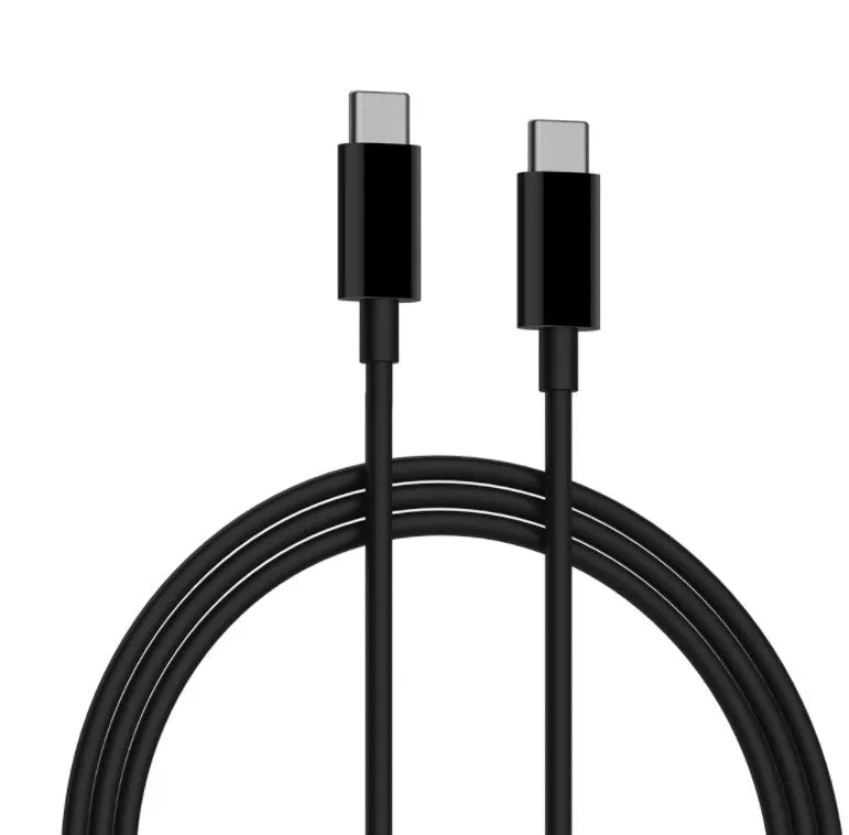Black ZMI USB-C 65W compact laptop power adapter showing size comparison