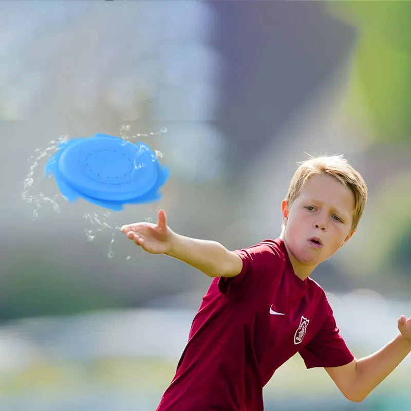 Silicone water toy in blue expression style on a wet surface for bath play