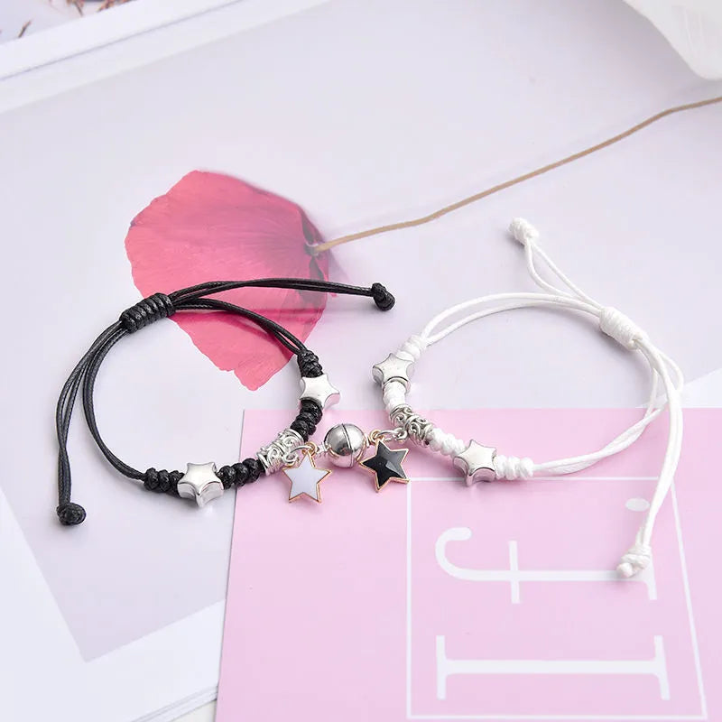 Magnet couple bracelets with electroplated finish showing magnetic clasp and symbolic design options