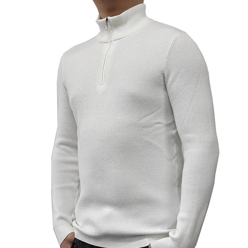 Man wearing a grey half turtleneck zip front sweater, a casual cotton blend pullover.