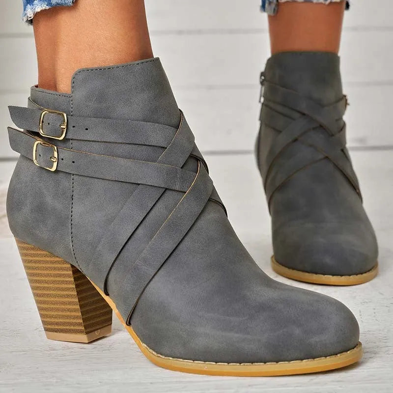 Plus size short ankle boots with a 7cm heel and side zip, shown in grey, black and brown.