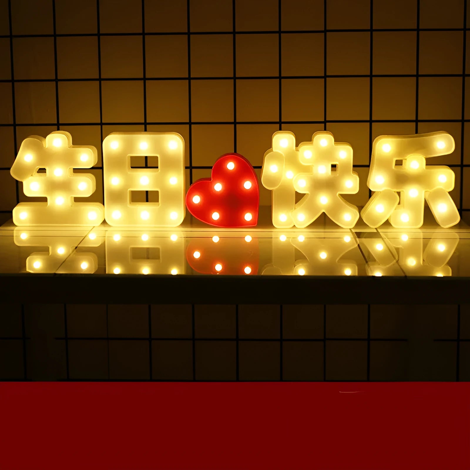Plastic LED letter light decoration spelling a message, 22cm in height.