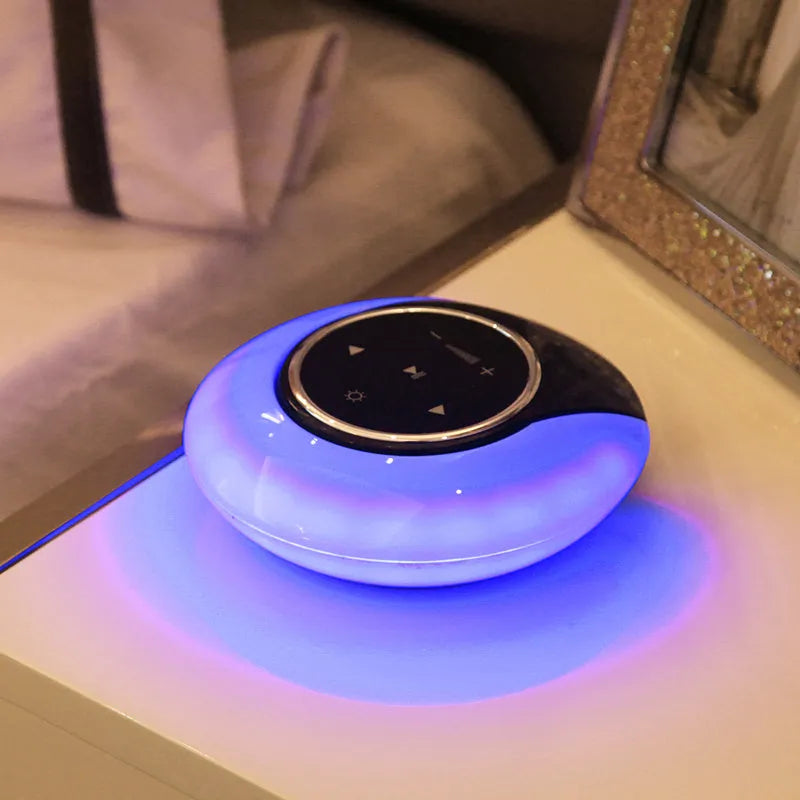 Blue Creative Bluetooth speaker desk lamp with foldable LED light and touch controls on a desk