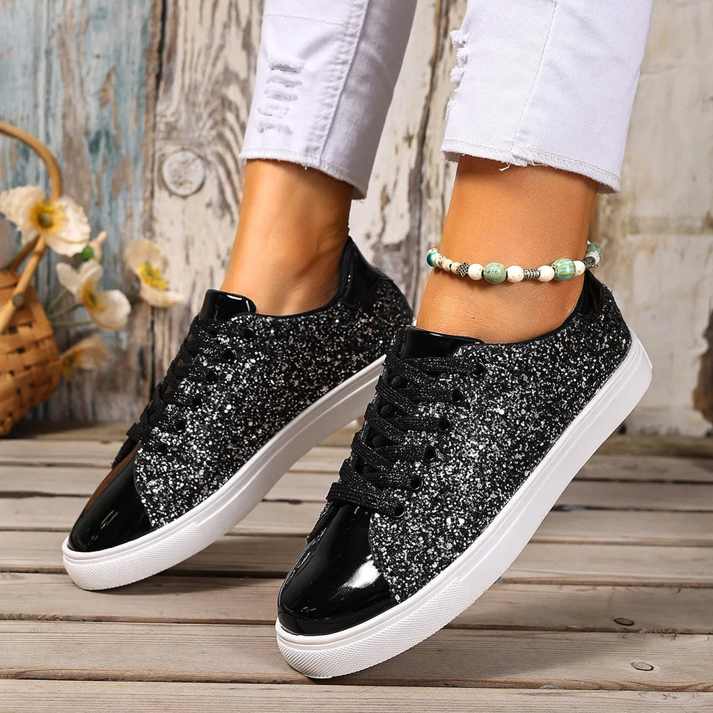 Women's black plus size board shoes with sequin detailing and white front lace-up fastening on a rubber sole.