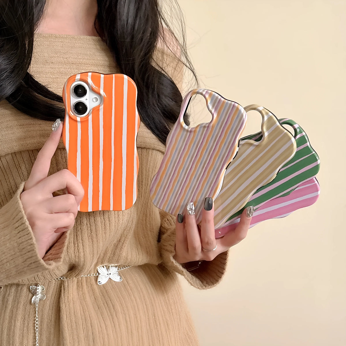 Colour-block striped film phone case showing orange and pink LQ5 wave stripe patterns on iPhone
