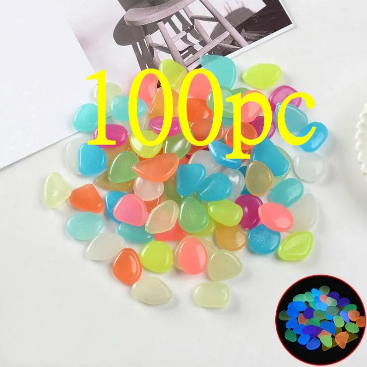 Luminous fluorescent aquarium and garden pebbles in mixed colours including dark purple, yellow, light blue, pink, orange