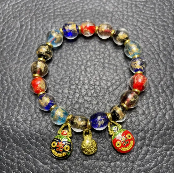 Ancient French Glaze Year Bracelet with geometric glass beads and auspicious patterns in multiple colours.