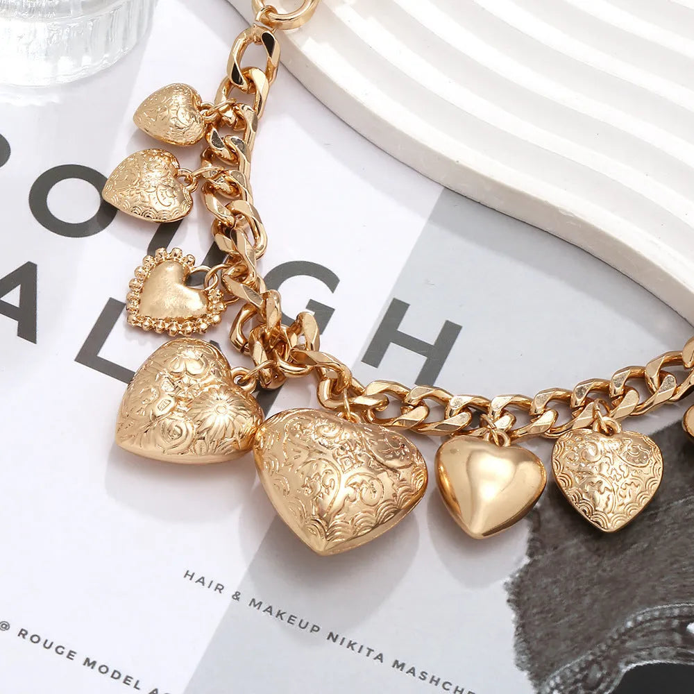 Gold alloy carved heart pendant necklace on adjustable metal chain