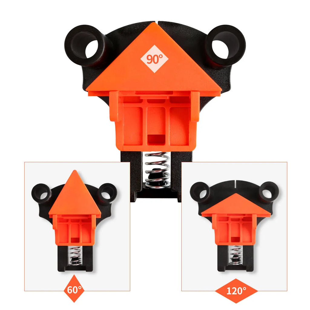 Set of four white plastic right angle clamps for picture frame assembly on a wooden surface.