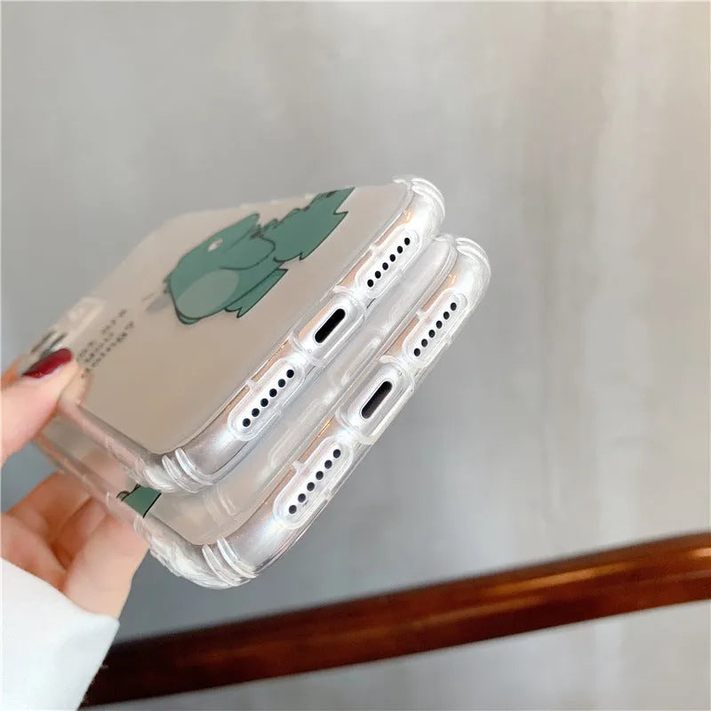 Transparent iPhone case with dinosaur design showing green dinosaur pattern on back