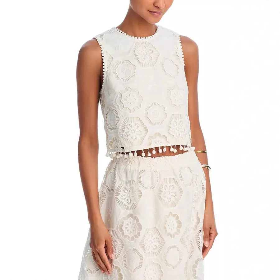 White women's two-piece suit with sleeveless top, long embroidered skirt, retro style.