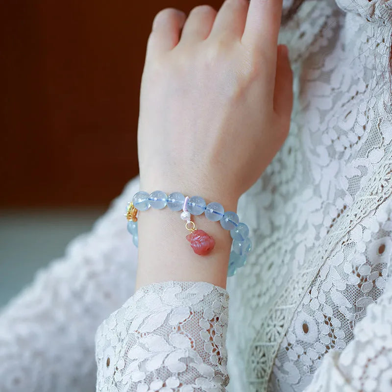Aquamarine gemstone and components for a DIY Fengjiu Chinese style bracelet kit for women.