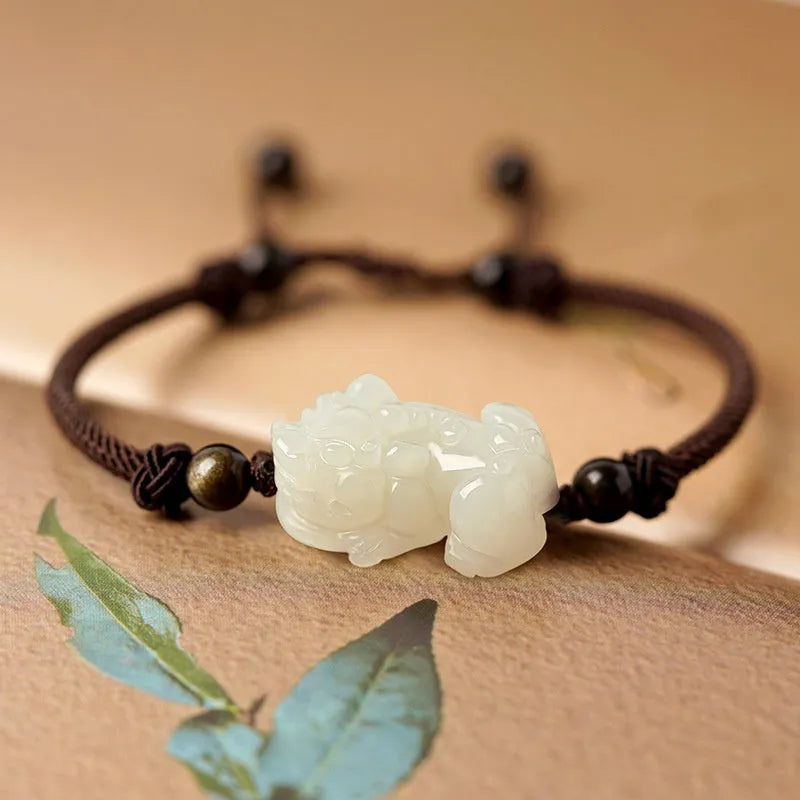 Traditional Chinese Hetian jade bracelet with black and red braided ropes and jade beads on elastic cord