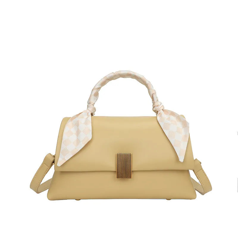 Medium-hardness PU shoulder handbag in horizontal square shape with visible sewing thread detail, black colour option