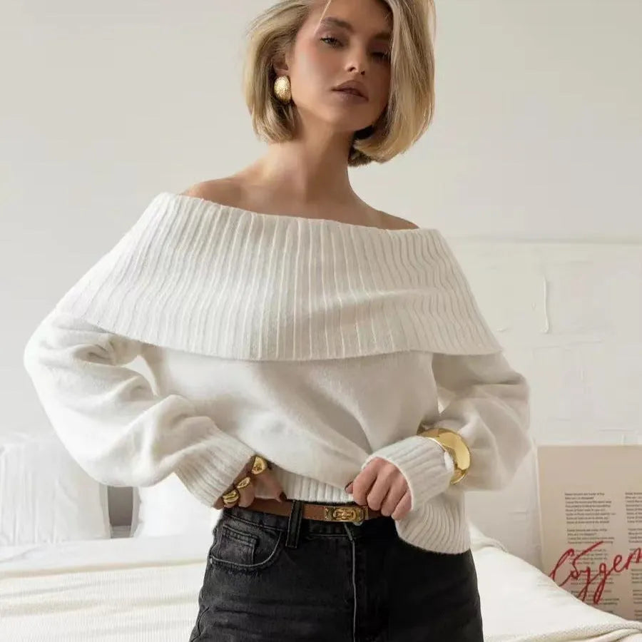 Grey off-the-shoulder strapless women's sweater with a 3D textured pattern.