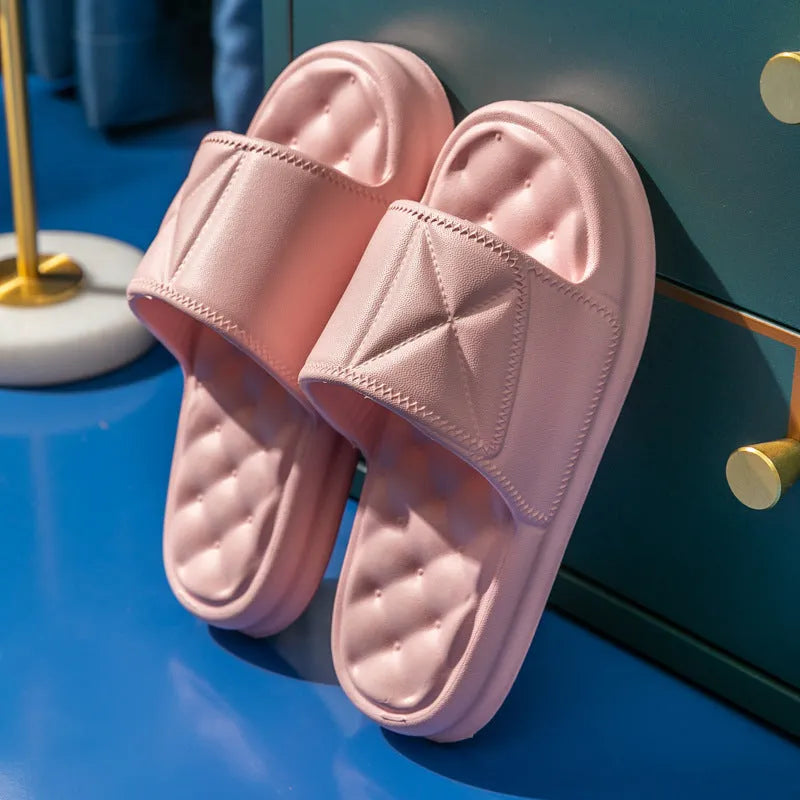 Pair of soft EVA non-slip bathroom slippers with a thick sole, shown in a choice of colours.