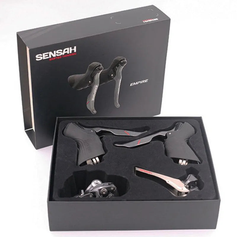 Aluminium road bike transmission kit showing hand change dial, front dial, short leg rear derailleur, chain, and decorative beads.