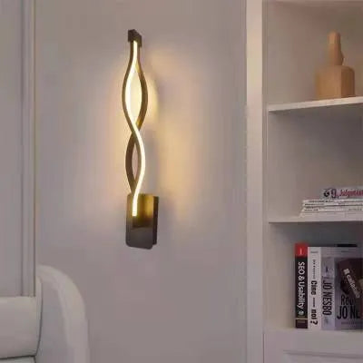 Minimalist Nordic design LED wall lamp with a silicone shade, mounted on a bedroom wall.