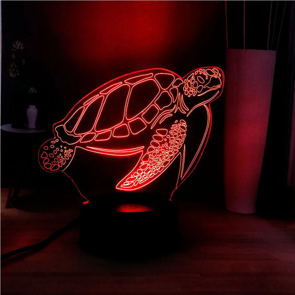 3D acrylic turtle-shaped LED night light with colour-changing illumination on a surface.