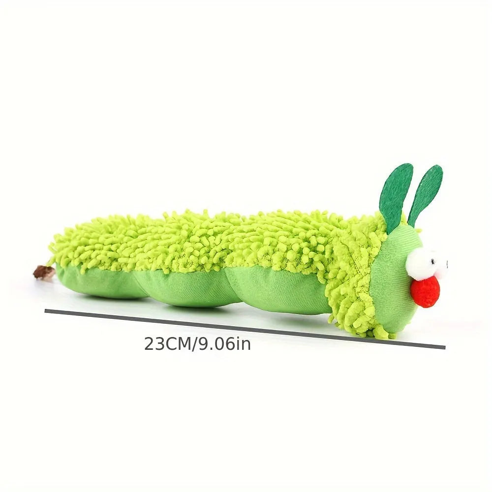 Green interactive plush cat toy pillow with sports design, showing scale.