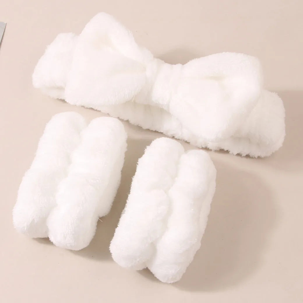 Facial brush and coral fleece hair band set in purple, grey, white, and pink colours.