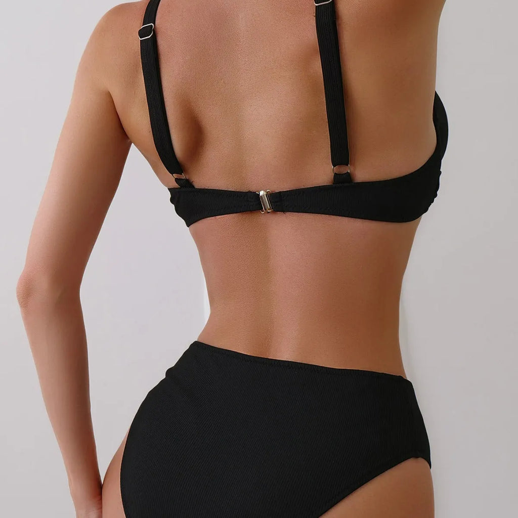 Women's solid colour ribbed fabric bikini swimsuit two-piece set on a hanger.