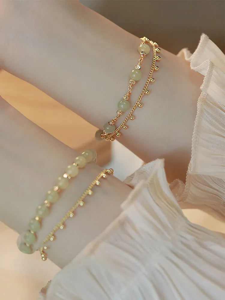 Hetian Jade bracelet with princess running beaded style on neutral background