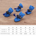 Set of cloth soft soled pet shoes for dogs in various colours on white background
